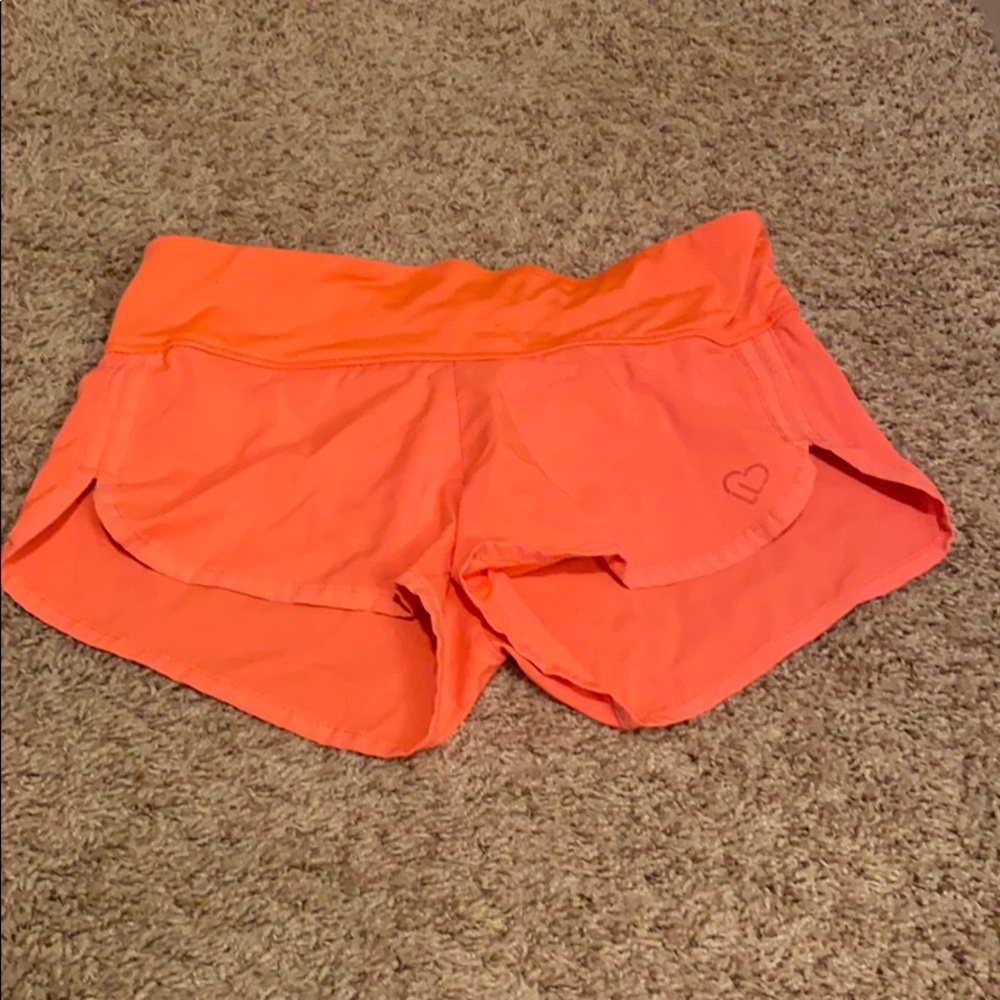 Neon orange running shorts